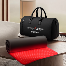 Black duffel bag with 'energizer' branding on a wooden surface with a red mat.