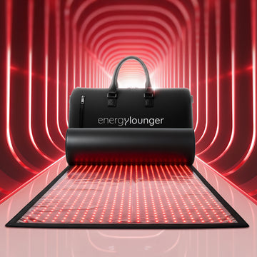 Black 'energylounger' mat and bag with red glowing lines on a tunnel-like background