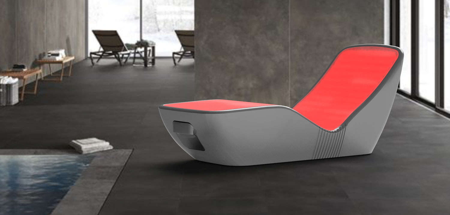Modern red and black energy lounger placed in a luxury indoor spa environment