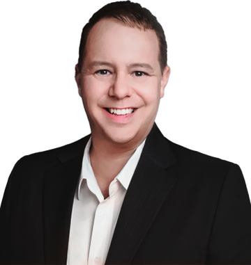 Professional headshot of the CEO of EnergyLounger, smiling and wearing a formal suit.